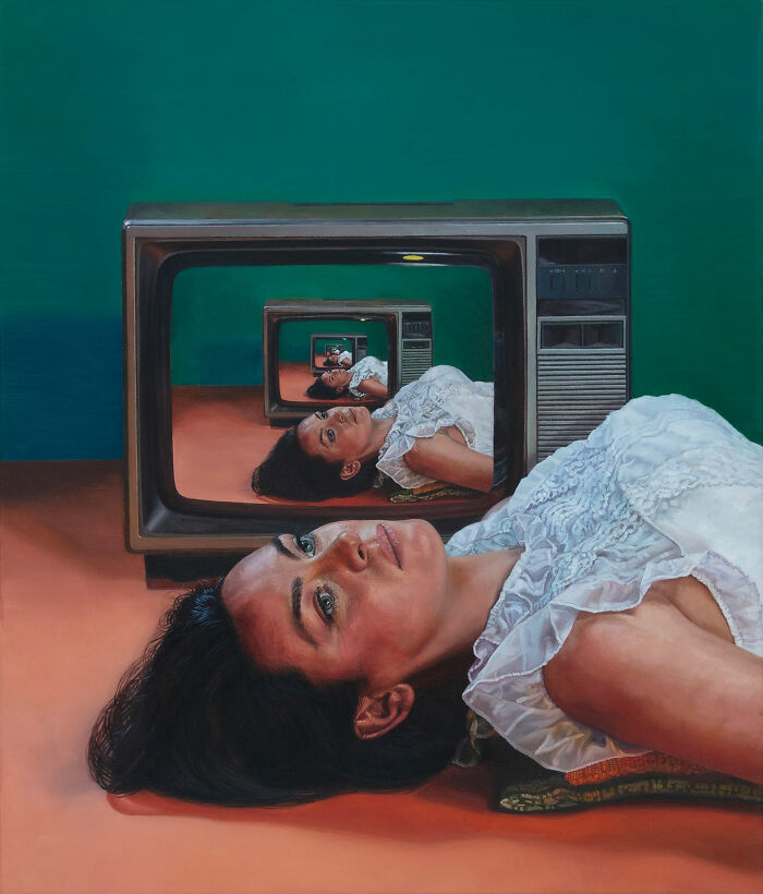 Hyperrealist paintings by Ian Cumberland: a woman lying on the floor with reflections in an old TV.