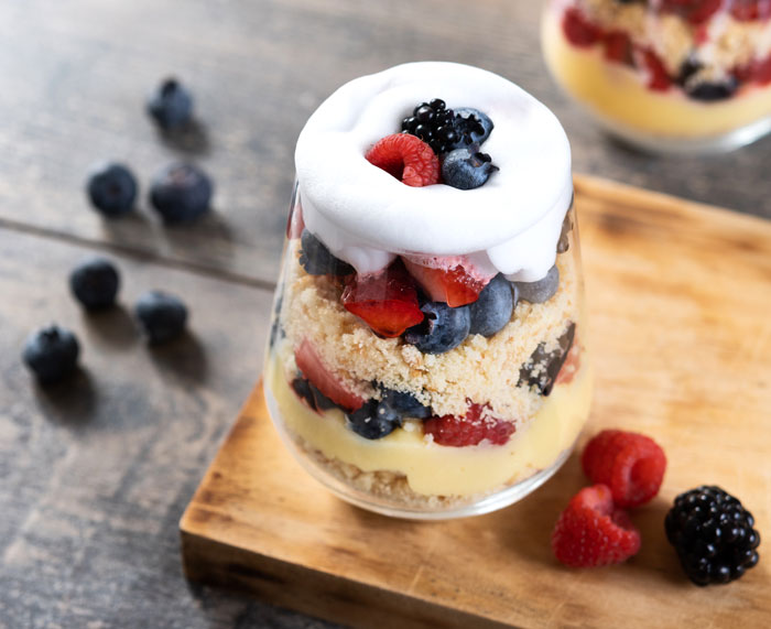 Delicious dessert with layers of fruit, whipped cream, and crumbs, a sweet treat that may be tampered with.
