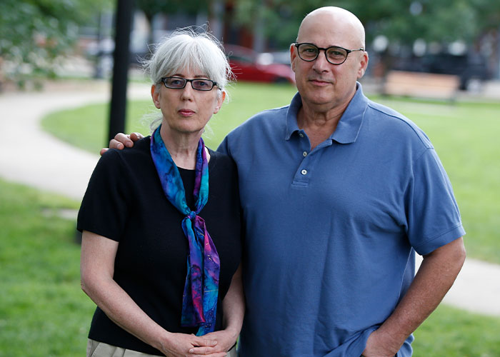 Old couple, targeted by eBay, stands together outside, facing the camera. eBay karma backfires spectacularly.