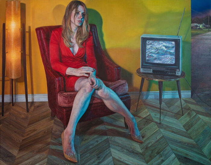 Hyperrealist paintings by Ian Cumberland: a woman in a red dress sits in a red armchair, a TV shows waves.