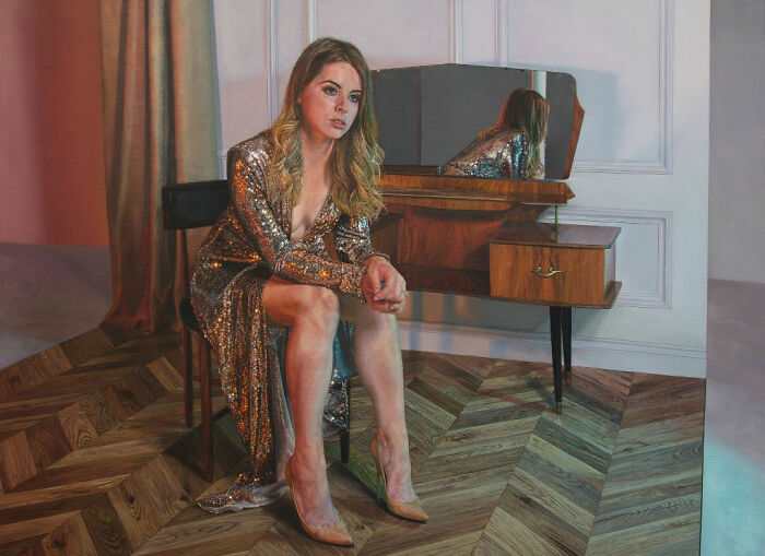 Hyperrealist painting by Ian Cumberland: A woman in a sparkling gown seated by a vanity, an Ian Cumberland hyperrealist painting with surreal details.