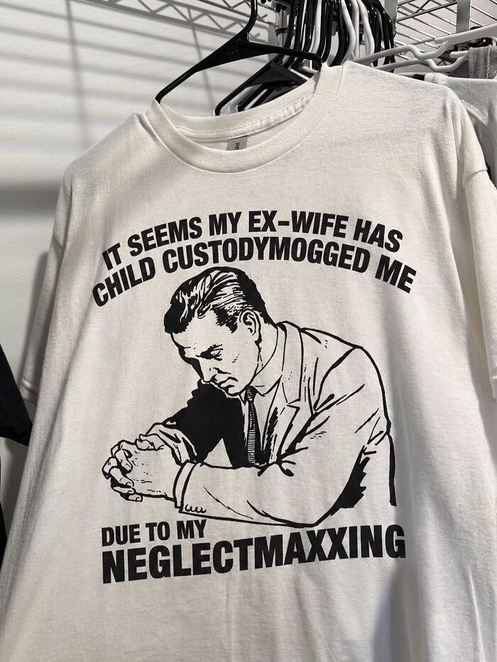 A white shirt with an iconic shirt design, depicting a man mourning, with text about child custody and neglectmaxxing.