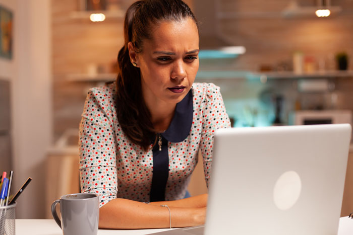 A woman, the ex-DIL, looks at her laptop, thinking about the ex-MIL's gift request. A woman, the ex-DIL, looks at her laptop, thinking about the ex-MIL's gift request.