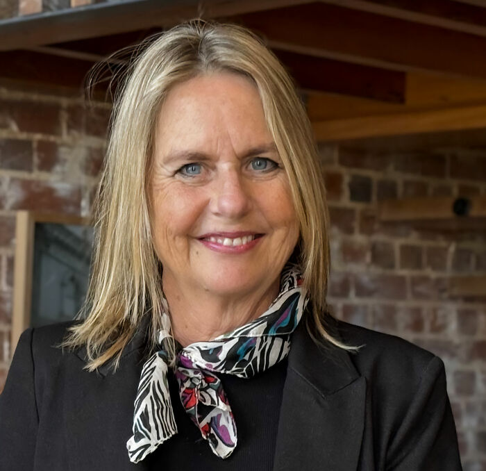 A politician smiles, a key figure in the livestreamed meeting scandal involving her background. A politician smiles, a key figure in the livestreamed meeting scandal involving her background.