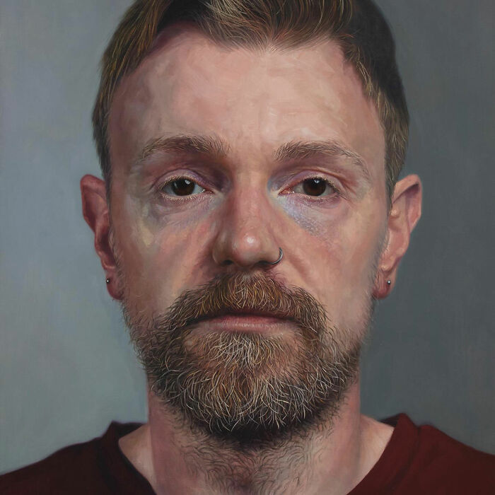 Hyperrealist painting by Ian Cumberland: A detailed portrait of a man with a beard and a nose ring.