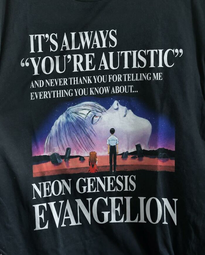 A black shirt with an iconic shirt design inspired by Neon Genesis Evangelion, with text about being autistic.