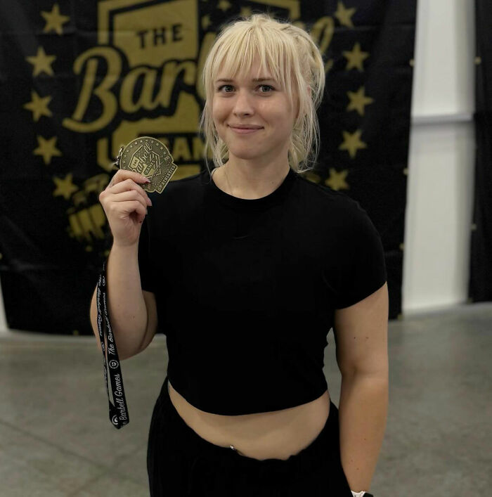 A smiling news anchor celebrates, holding a medal, highlighting the hilarious reactions to her viral video. A smiling news anchor celebrates, holding a medal, highlighting the hilarious reactions to her viral video.