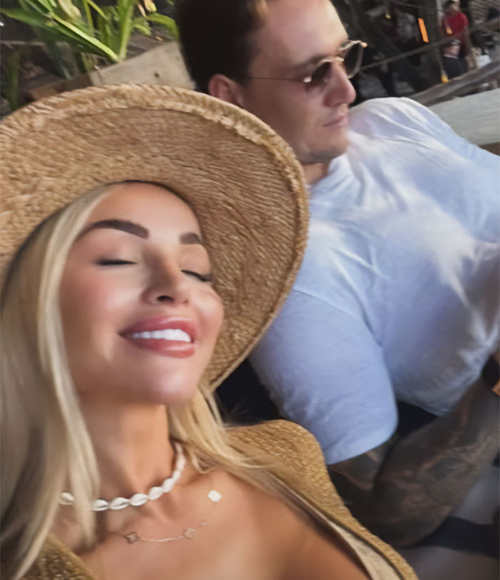 Young woman and man relaxing, vacationers urged to be careful in Bali after a nightmare experience.