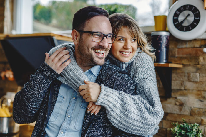 A happy couple embracing, representing a poly wife and her hubby after resolving issues related to the best friend. A happy couple embracing, representing a poly wife and her hubby after resolving issues related to the best friend.