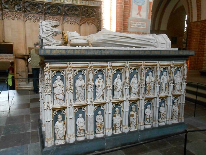 An ornate tomb with sculpted figures, reflecting fascinating human history of the Middle Ages.