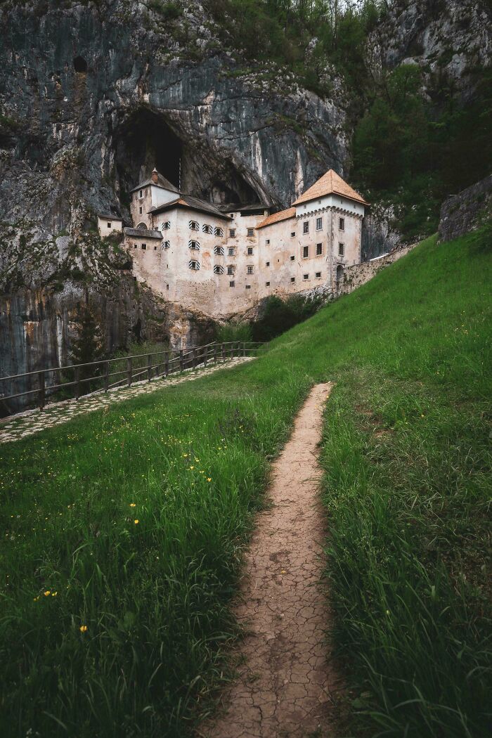 Predjama Castle, a stunning medieval fortress built into a cave, a marvel from the Middle Ages.