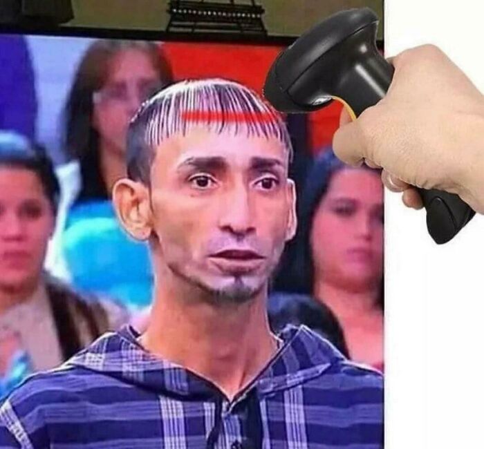 Man with a barcode hairstyle having a scanner pointed at his head, featuring bold hairstyles.