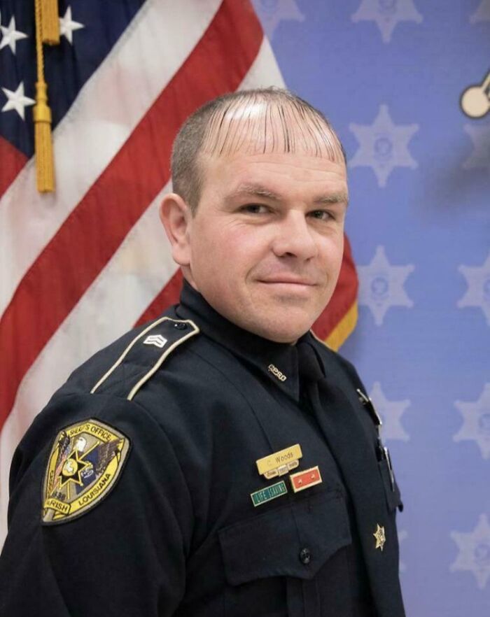 A policeman with a very short fringe, an example of bold hairstyles.