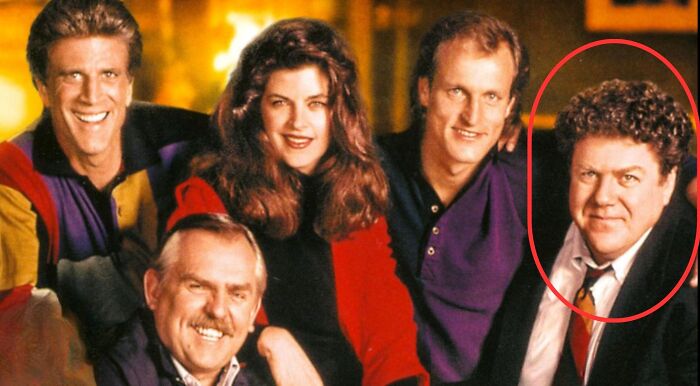 A Cheers cast photo with Norm Peterson circled. Find out Norm Peterson's profession and what line of work he's in.