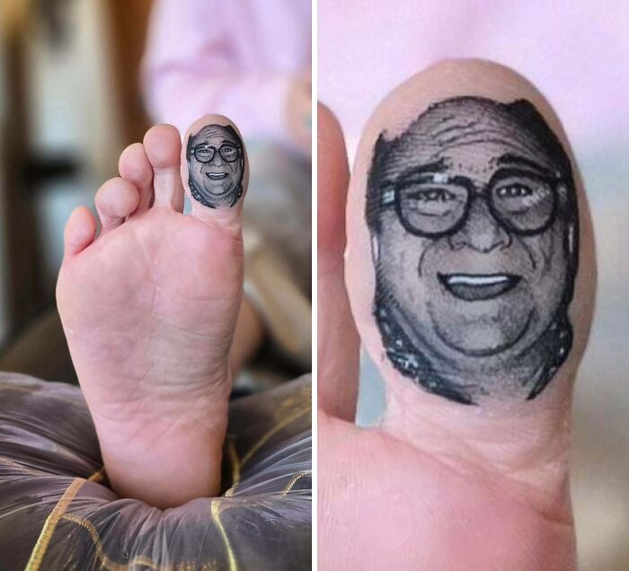 A detailed portrait tattoo of Danny DeVito on a big toe, a humorous example of stunning tattoos.