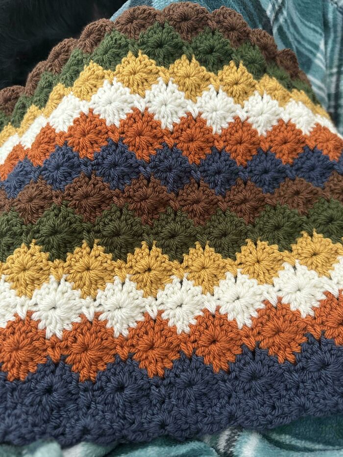 Multicolor crochet pattern featuring autumn-inspired yarn colors in diamond shapes
