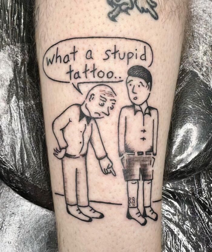 A comic-style leg tattoo of an older man pointing at a younger man, with a speech bubble saying 'what a stupid tattoo..', illustrating stunning tattoos.