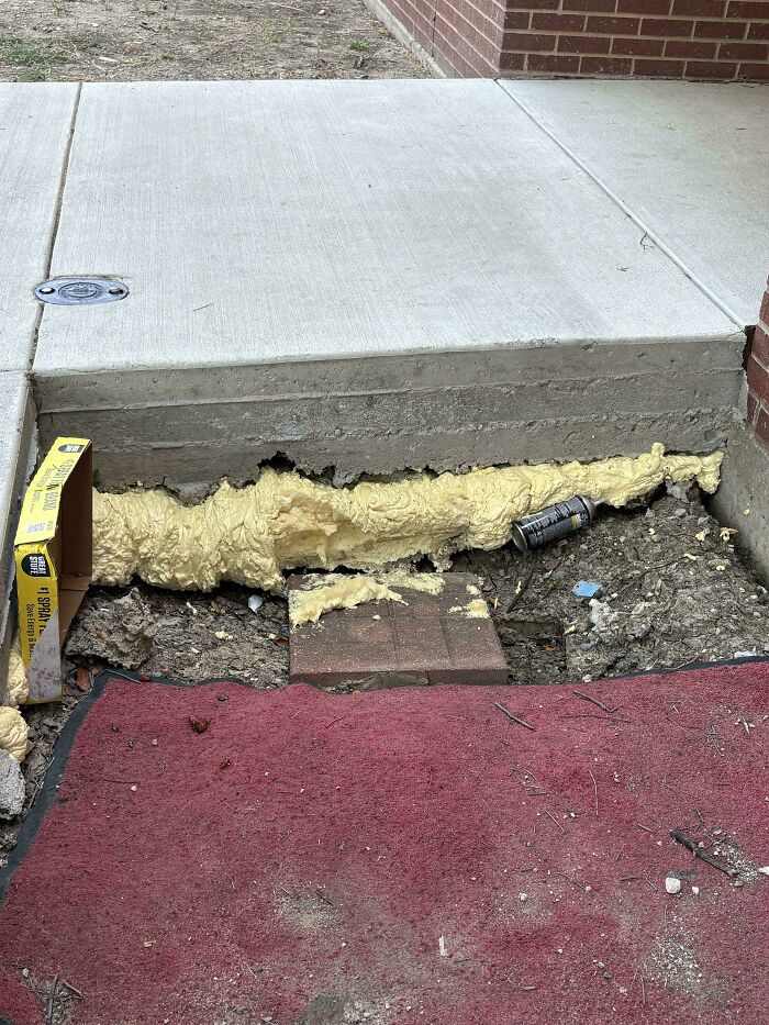 Expanding foam used to fill a gap under a concrete slab, illustrating clever solutions from random junk.