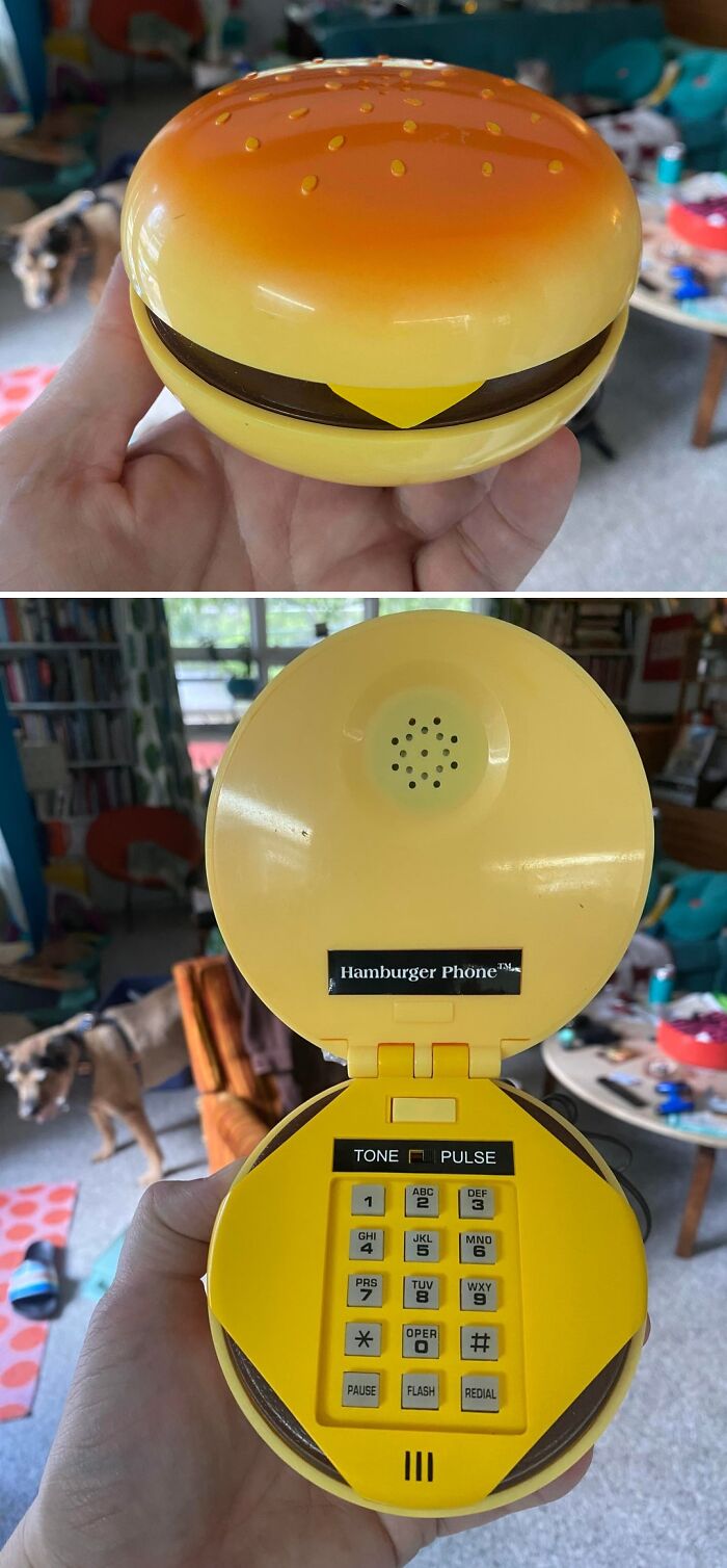 A person holds a novelty Hamburger Phone, revealing its keypad, a fun thrift store jackpot.