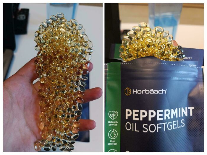 A hand holding peppermint oil softgels melted together by summer heat, next to its packaging.