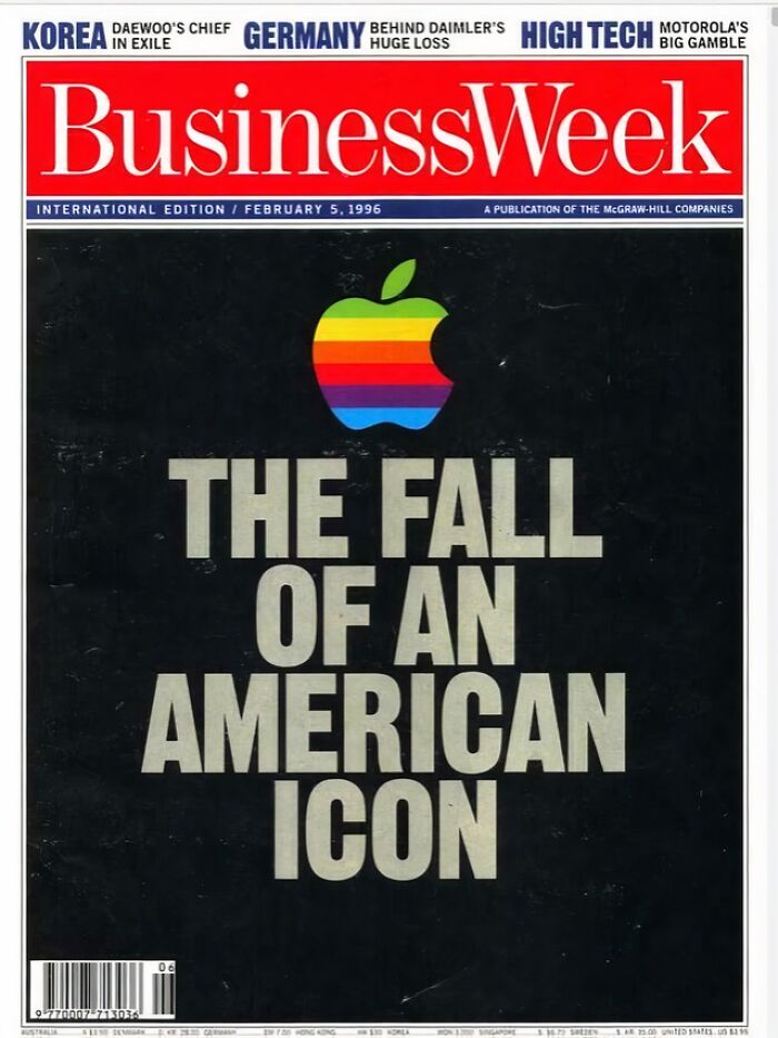 A 1996 BusinessWeek magazine cover with a rainbow Apple logo and the headline The Fall of an American Icon, which aged so poorly.