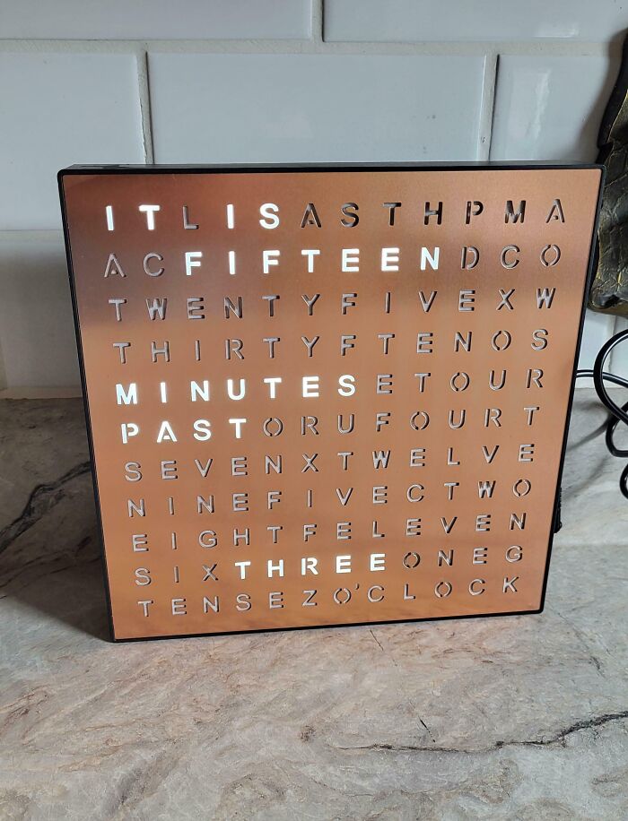 Copper word clock displaying time as words, a clever and stylish thrift store jackpot.