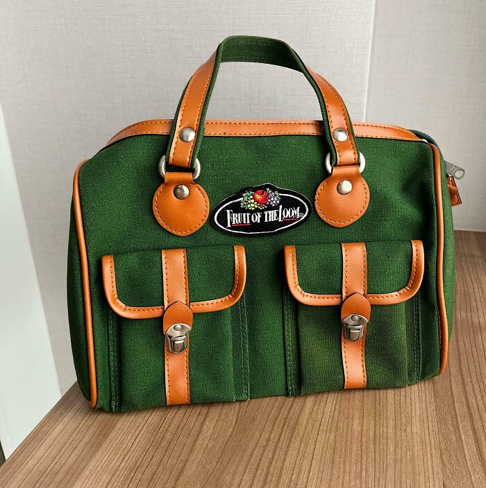 A vintage Fruit of the Loom handbag in green canvas with tan leather accents, a real thrift store jackpot.