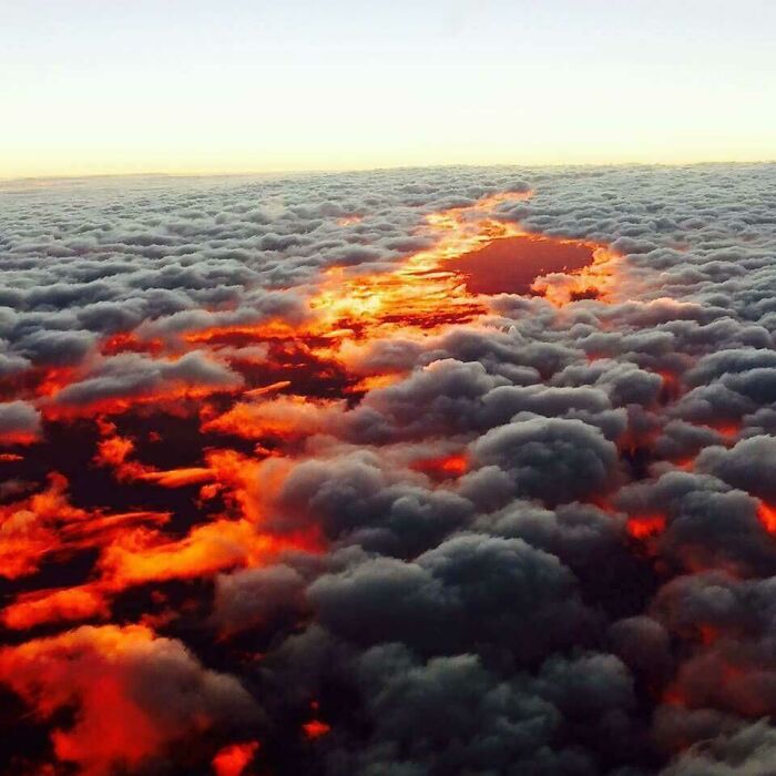 Confusing pic of a sunset with misleading headlines, clouds glowing like a fiery brain.
