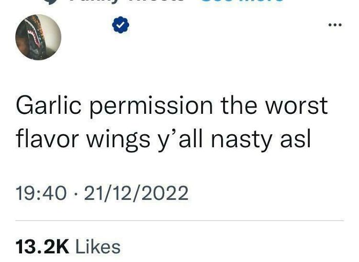 A social media post about garlic flavor wings, highlighting a funny interaction from dumb people on the internet.