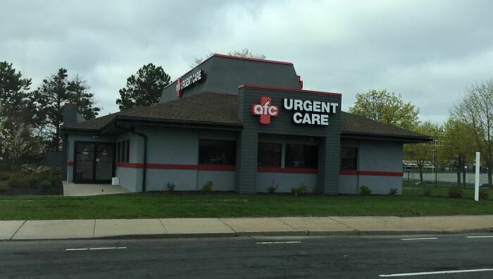 A former fast-food building pretending to be an AFC Urgent Care clinic, featuring its distinctive gray and red design.