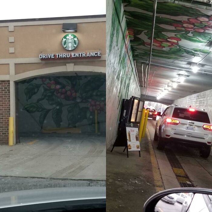 A Starbucks drive-thru entrance in a building that is pretending to be something it is not.