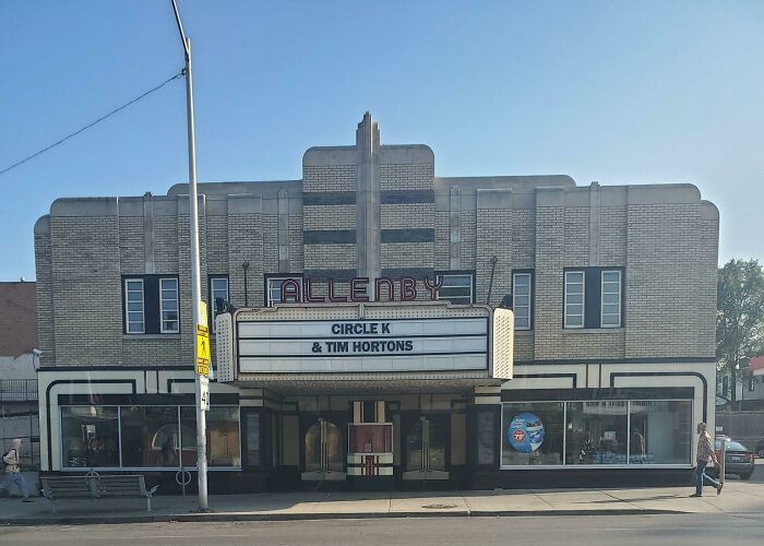 An old theatre building pretending to be a Circle K & Tim Hortons.