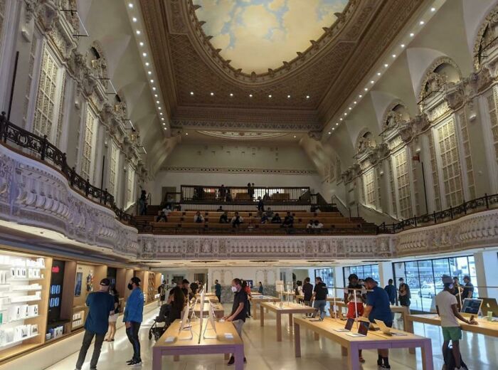 An Apple Store inside a grand, old building pretending to be a theatre.