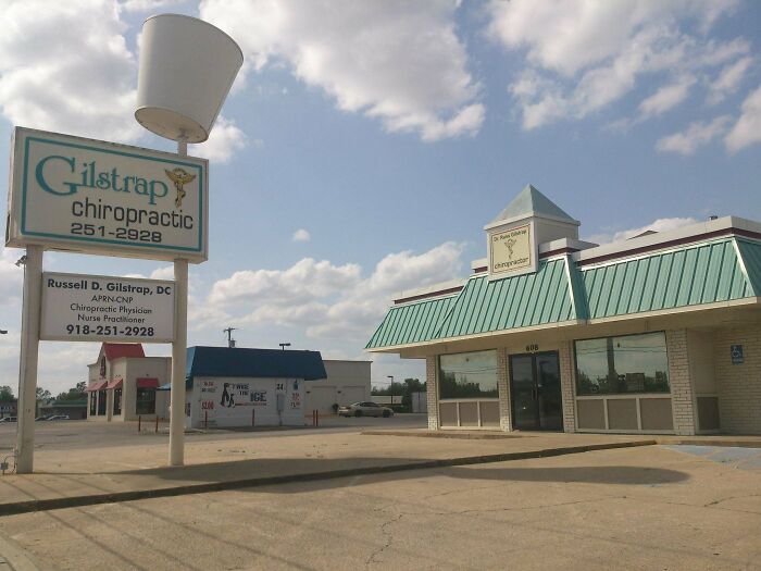 Gilstrap Chiropractic, a building pretending to be something it is not, with a large sign and drive-thru style roof.