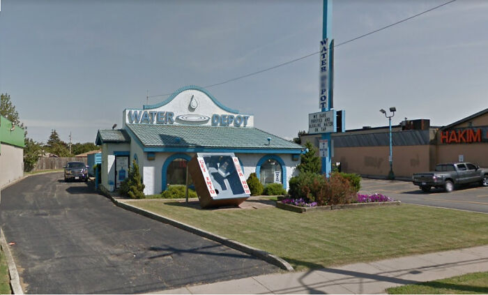 A Water Depot building designed to look like a water bottle, one of many buildings pretending to be something else.