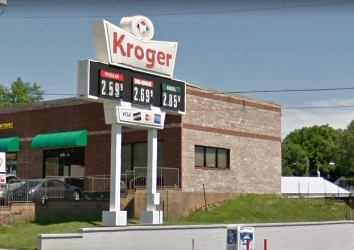 A Kroger gas station with a brick facade, illustrating a building pretending to be something else entirely.