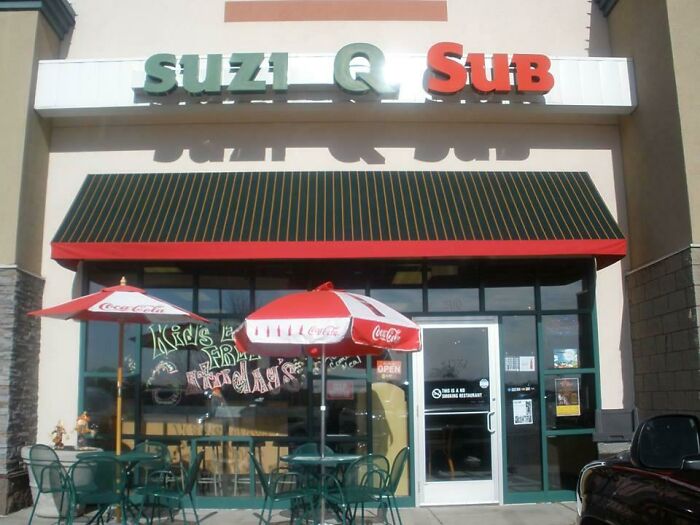 Suzi Q Sub, a fast food restaurant, possibly a building pretending to be something else with its unique design.