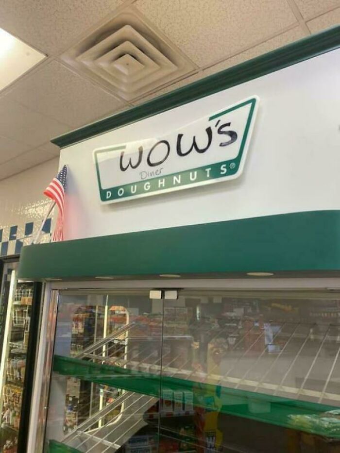 The sign for Wow's Diner Doughnuts inside a store, suggesting a building pretending to be something it's not.