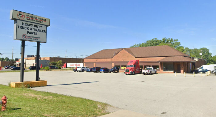 A former Pizza Hut building now housing a Road Equipment Parts Center, an example of buildings pretending to be something they're not.