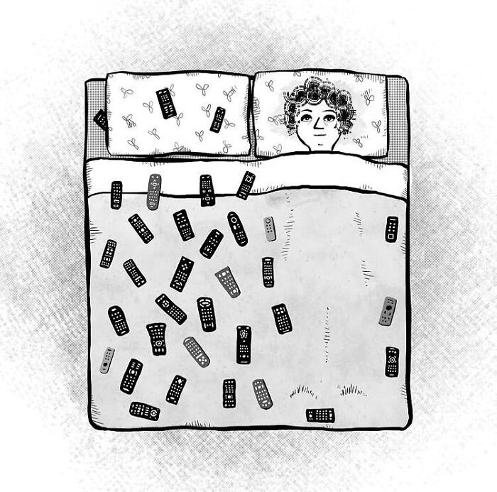 A one-panel comic: a person lies in bed, covered by a blanket adorned with numerous TV remote controls, showcasing everyday thoughts.