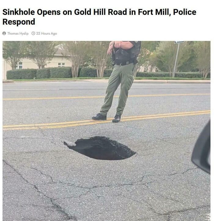 A police officer stands near a hazardous sinkhole on Gold Hill Road, exemplifying dangerous things.