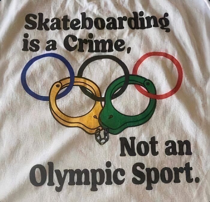 A T-shirt reads Skateboarding is a Crime, Not an Olympic Sport, with Olympic rings replaced by handcuffs, highlighting things that aged so poorly.