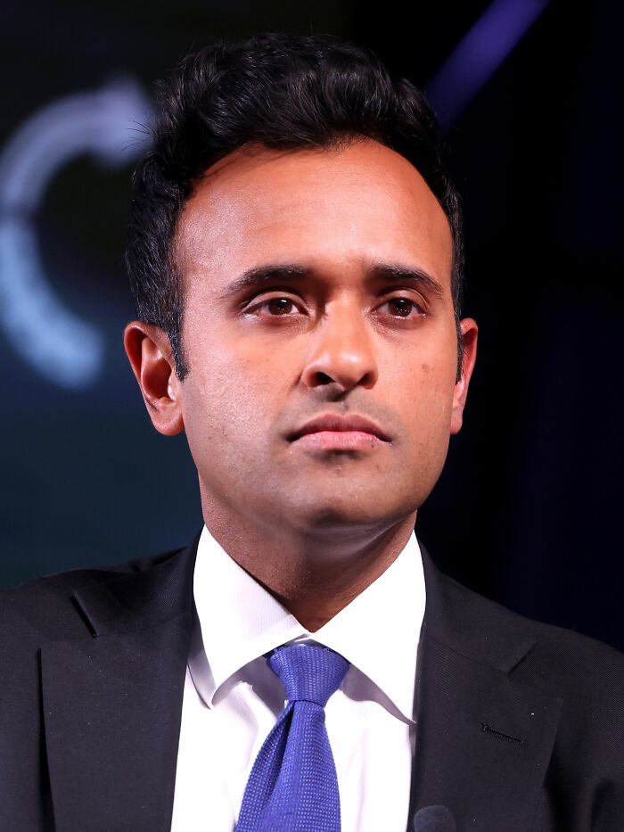 Vivek Ramaswamy close-up, focusing on his bio and career highlights. A direct gaze from the entrepreneur.