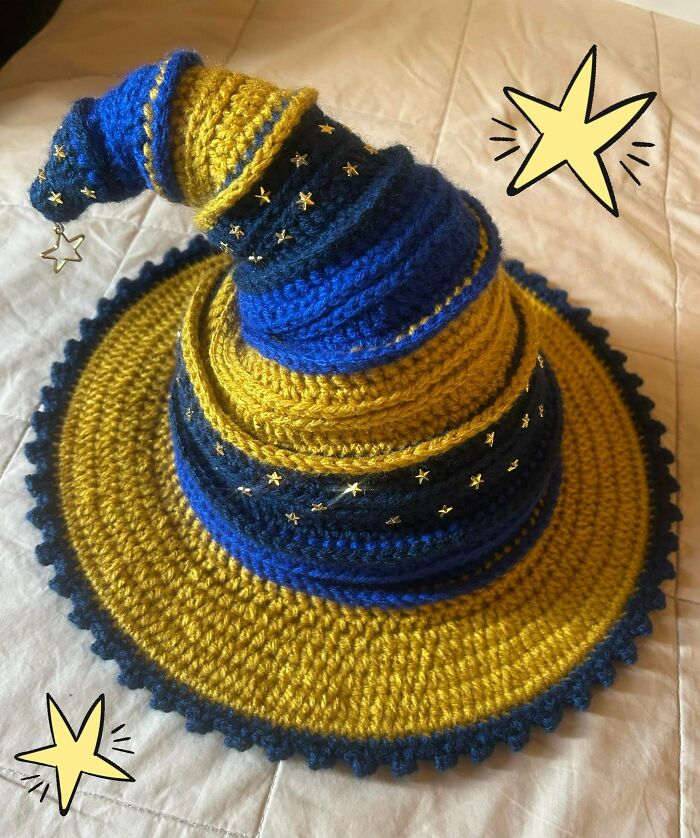 Blue and yellow crochet wizard hat decorated with stars