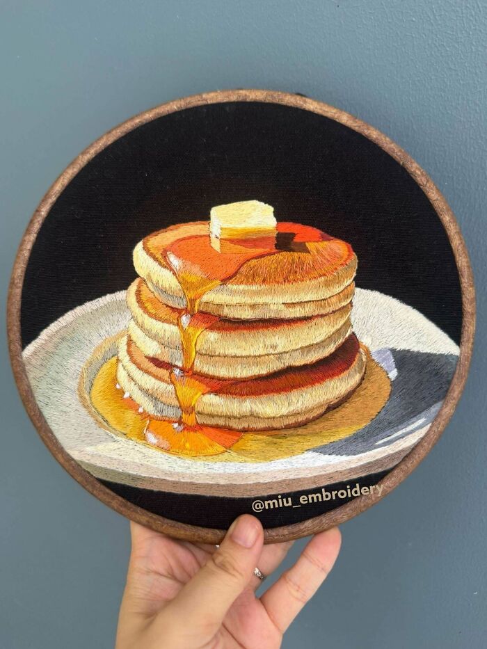 Realistic embroidery projects showing a stack of pancakes with melting butter and syrup in a hoop
