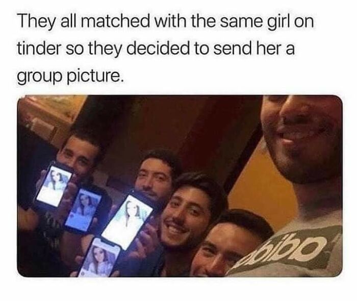 Four men smiling and holding up their phones, showing that they all matched with the same girl on Tinder, an online dating platform.