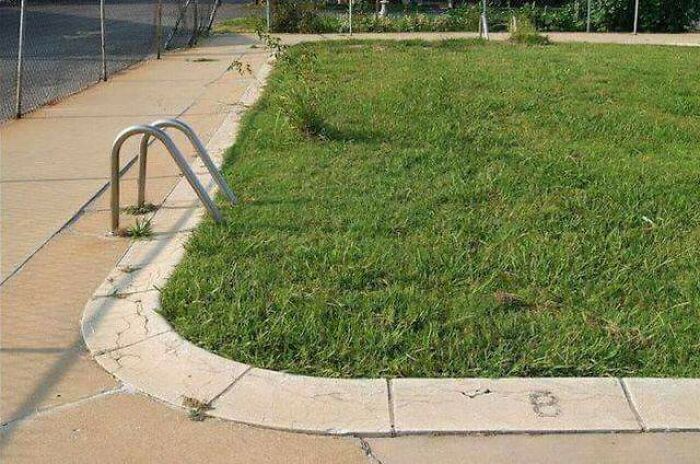 Pool ladder leading into a grassy area, an unexplainable pic that people cannot explain.