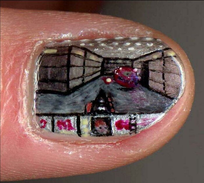 A tiny, detailed painting of a video game scene on a fingernail, an image that people cannot explain or forget.