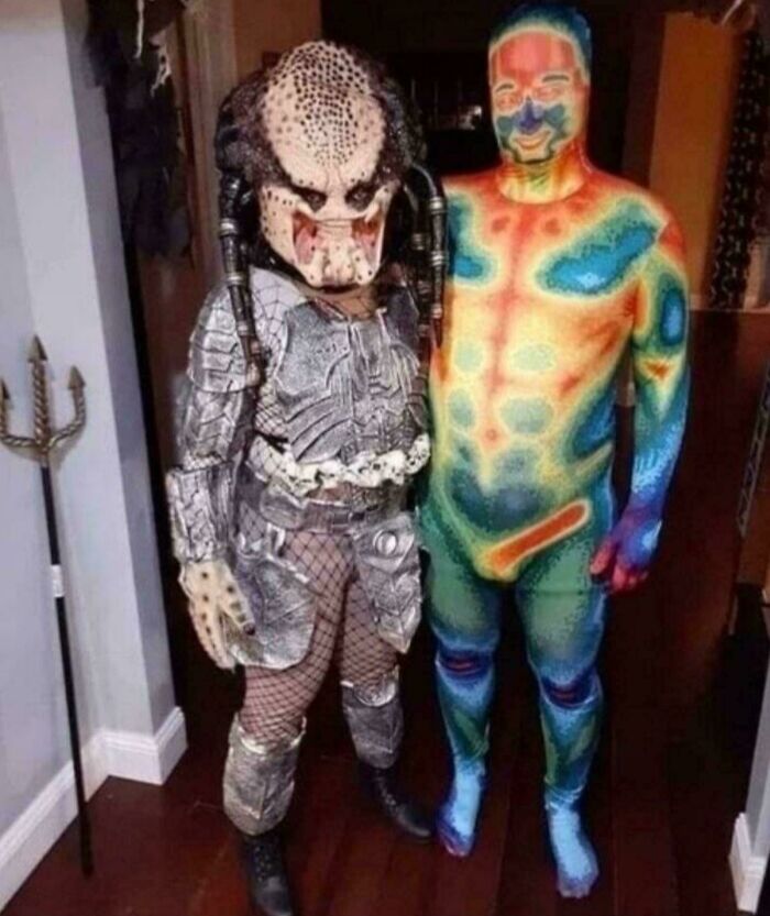 Two people in Halloween costumes: one as a Predator, the other in a thermal body suit revealing body heat. Cannot Explain Pics.