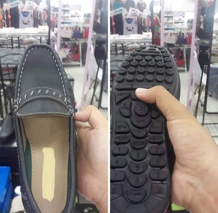 A pair of hands holding a loafer shoe with an inexplicable TV remote control design on its sole, a truly unforgettable image.